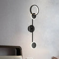 Modern black and white metallic round led wall sconce with sleek minimalist design for living room lighting