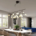 Modern black metal branching chandelier with frosted glass globe bulbs for dining room lighting