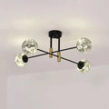 Modern black and brass decorbites™ starry nordic ball semi flush light fixture with four clear glass globes for living room ceiling