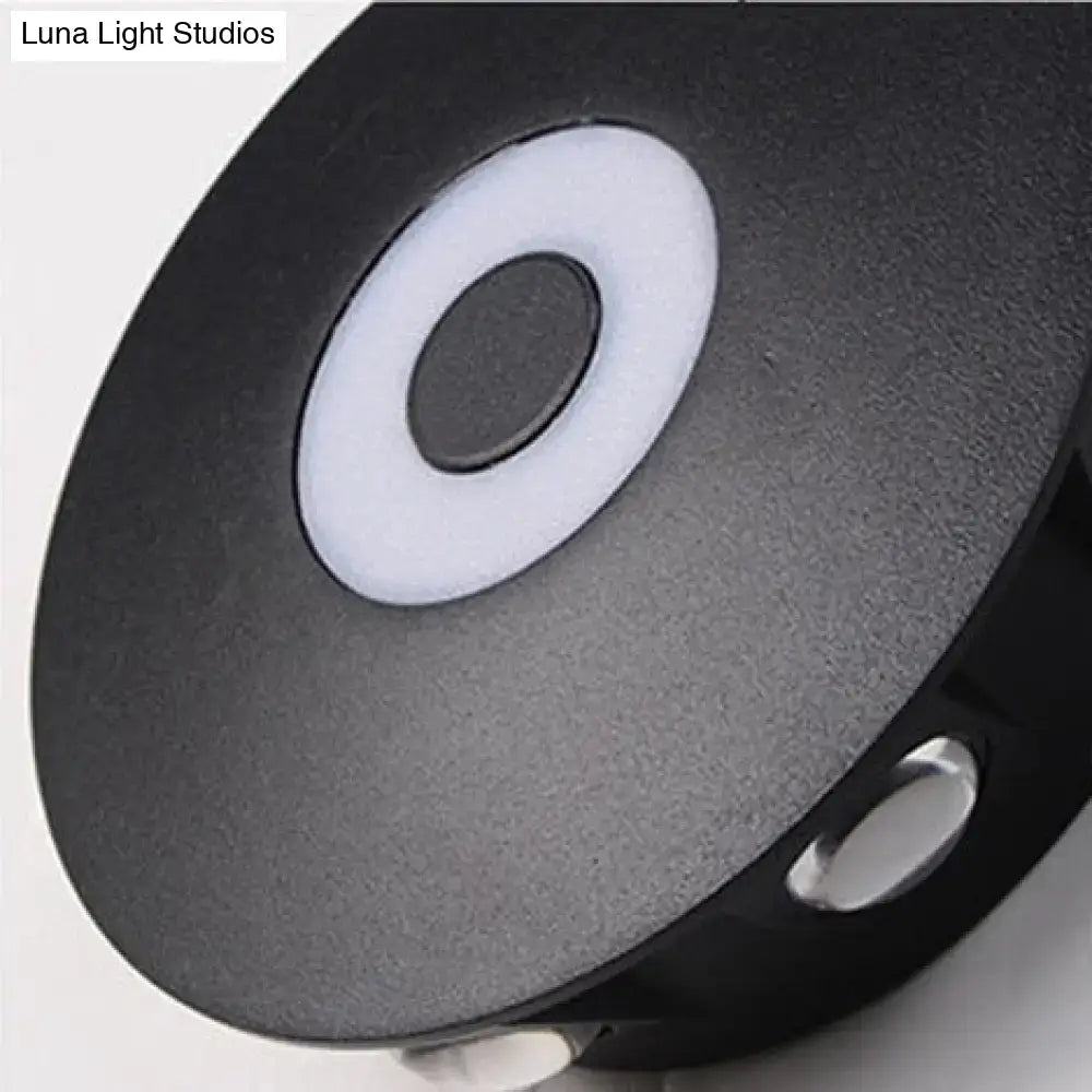 Modern black circular led outdoor wall sconce with matte finish and concentric white ring design for outdoor wall lighting