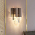 Modern black crystal wall light with vertical metallic slats and cascading crystal prisms for bedroom use