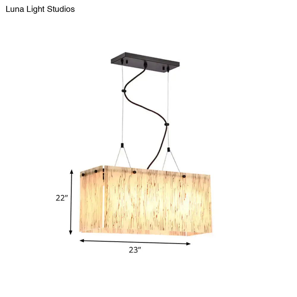 Modern black dining room pendant light with amber glass shade