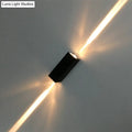 Modern black finish wall lamp dual beam sconce emitting two warm golden light beams for hotel and indoor use
