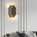 Modern black and gold geometric led wall lamp with matte black exterior and warm gold interior lighting for bedroom sconce
