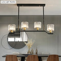 Decorbites™ modern island pendant light with black metal frame, clear crystal cylinder shades, and gold-toned barrel shade shape