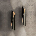 Modern black and gold twisted wall sconce light with sleek design ideal for corridor wall sconce lighting