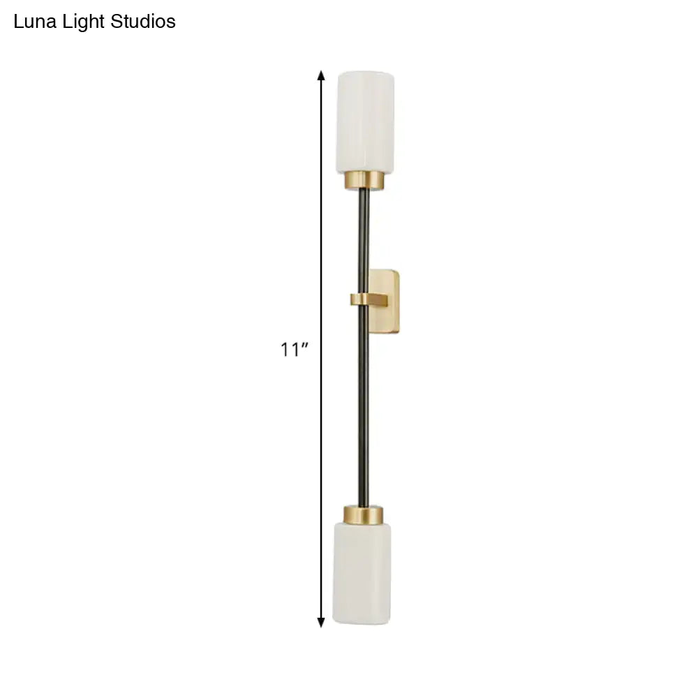Modern black & gold wall sconce with white glass shade living room