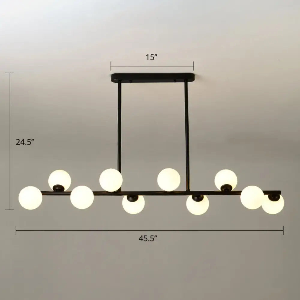 Modern black island ceiling light with frosted globes dining room