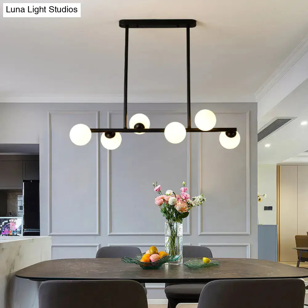 Modern black island ceiling light with frosted globes dining room