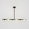 Modern black island pendant with clear glass globes dining room