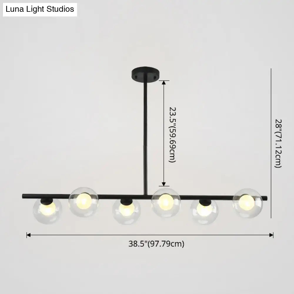Modern black island pendant with clear glass globes dining room