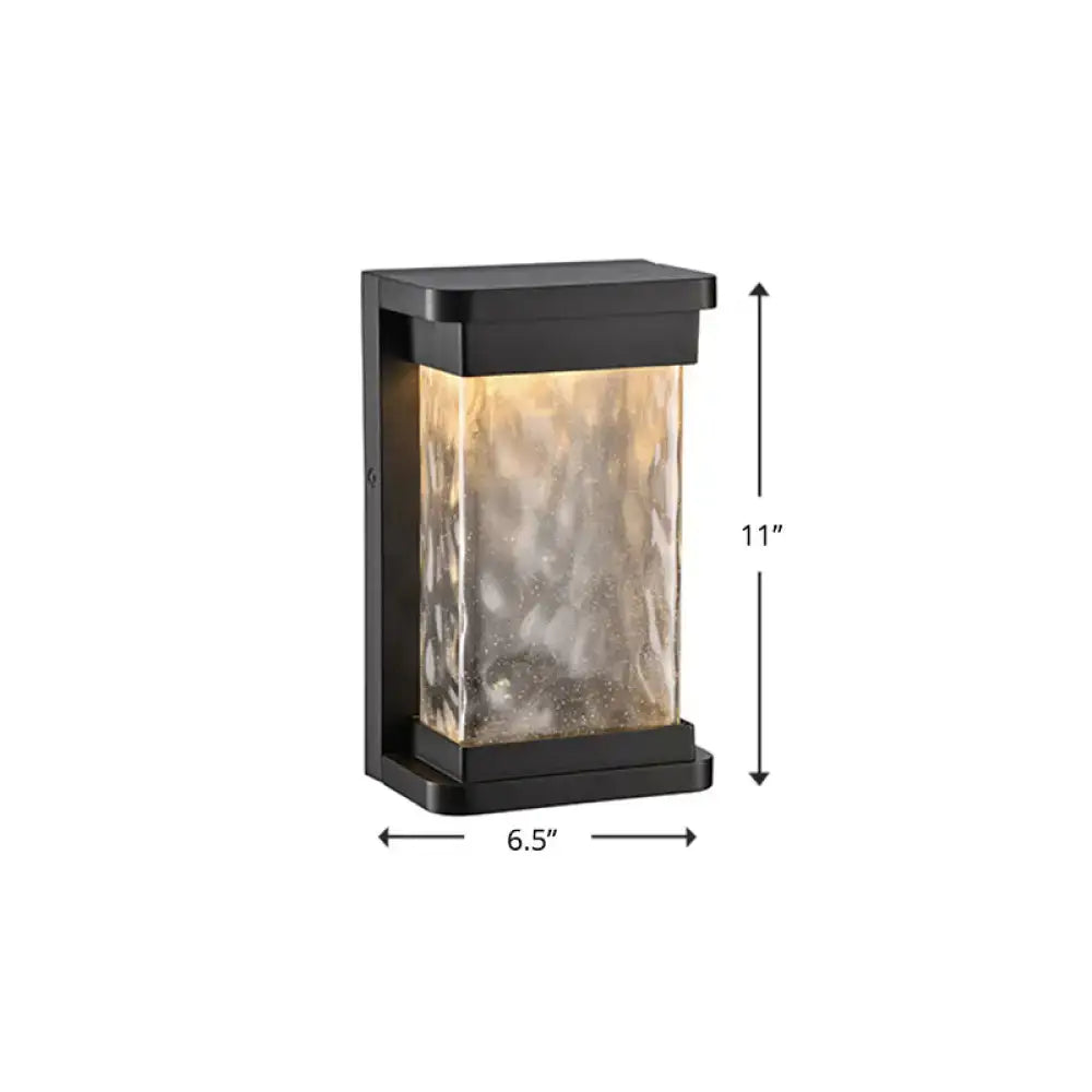 Modern black led outdoor wall sconce with rippled glass cylinder