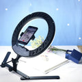 Modern black led ring flash lamp with metallic shade featuring adjustable stand and phone mount for photography lighting