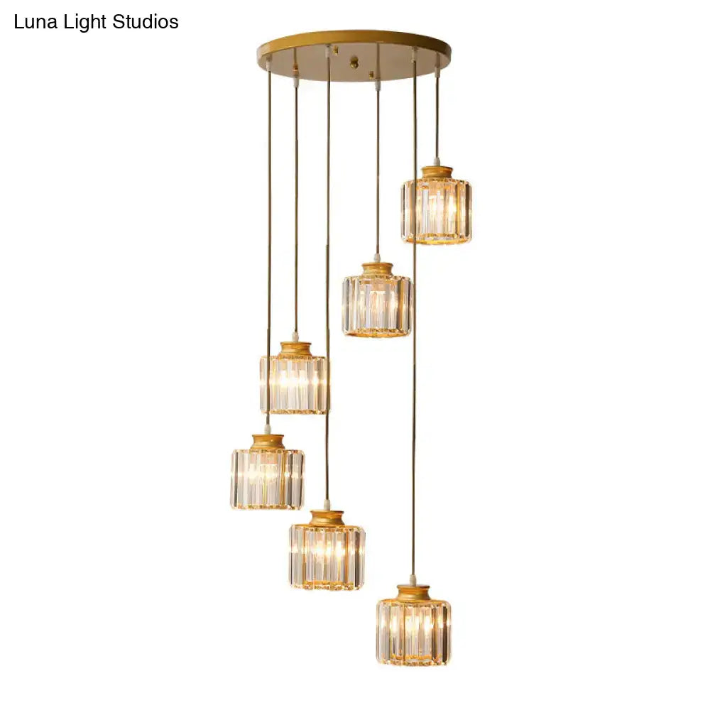 Gold-toned prismatic crystal cylindrical pendant chandelier with five faceted glass shades for stairway lighting