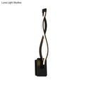 Modern black twisted led wall sconce with warm white light designed for stairway and bedroom lighting