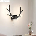 Modern black and white antler wall sconce with warm white led lighting and pull chain switch for bedroom use