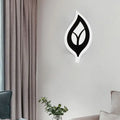 Modern black and white leaf sconce light with minimalist wall lamp design for bedroom decor