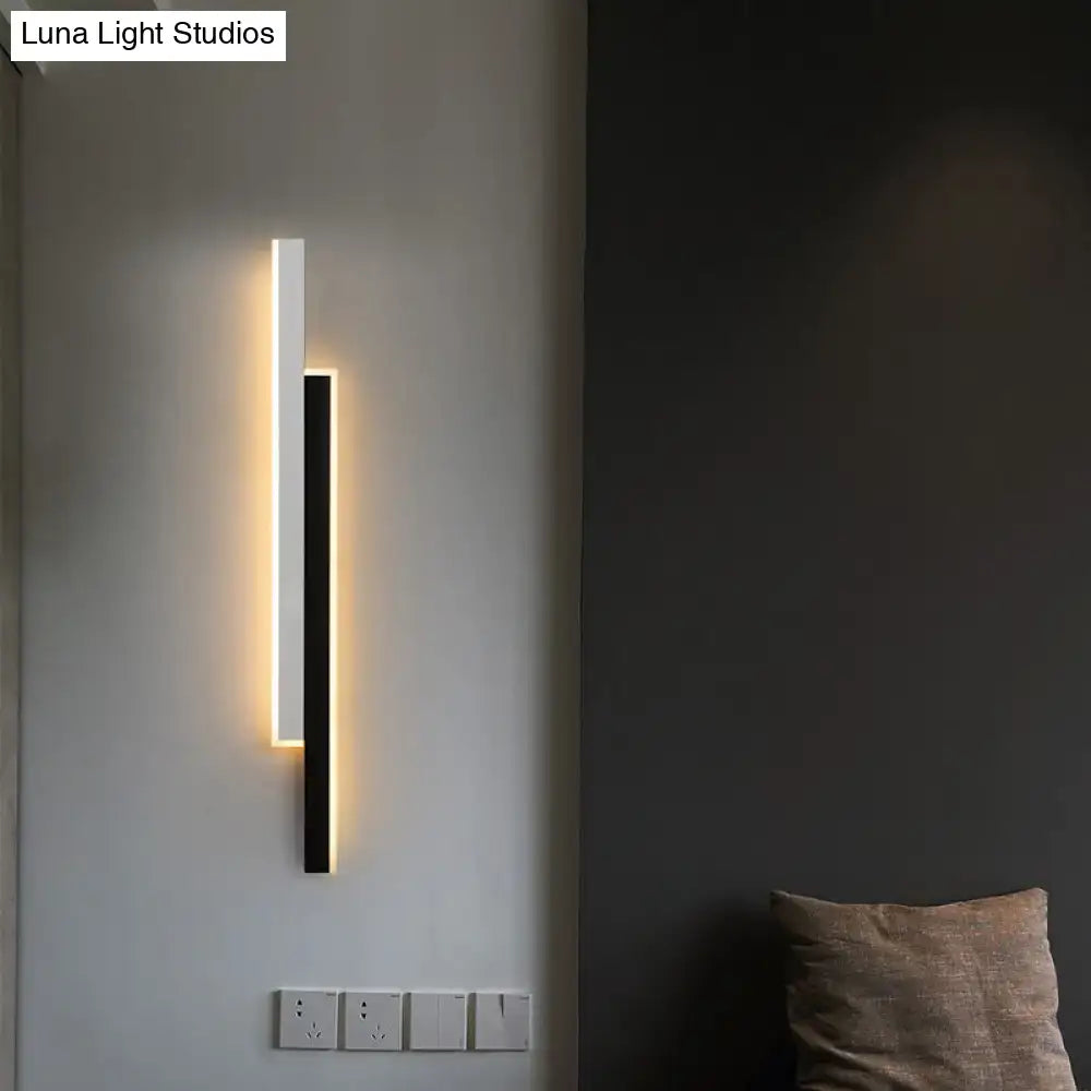 Modern black and white linear led wall light with sleek minimalist design and warm edge lighting for corridor use