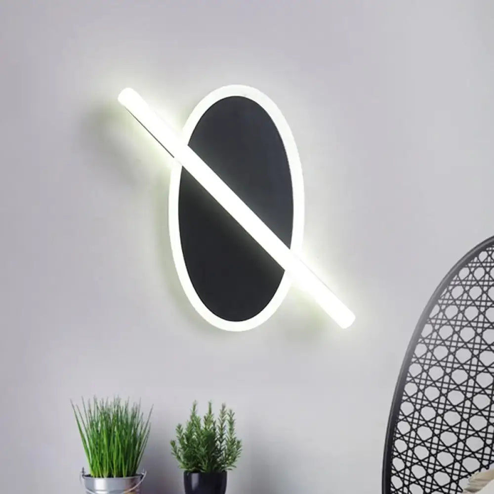 Modern black & white oval led sconce stairway light with warm glow