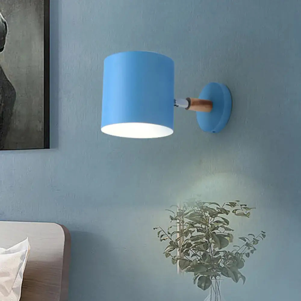Modern blue metal tubular wall lamp with wood arm bedroom sconce light
