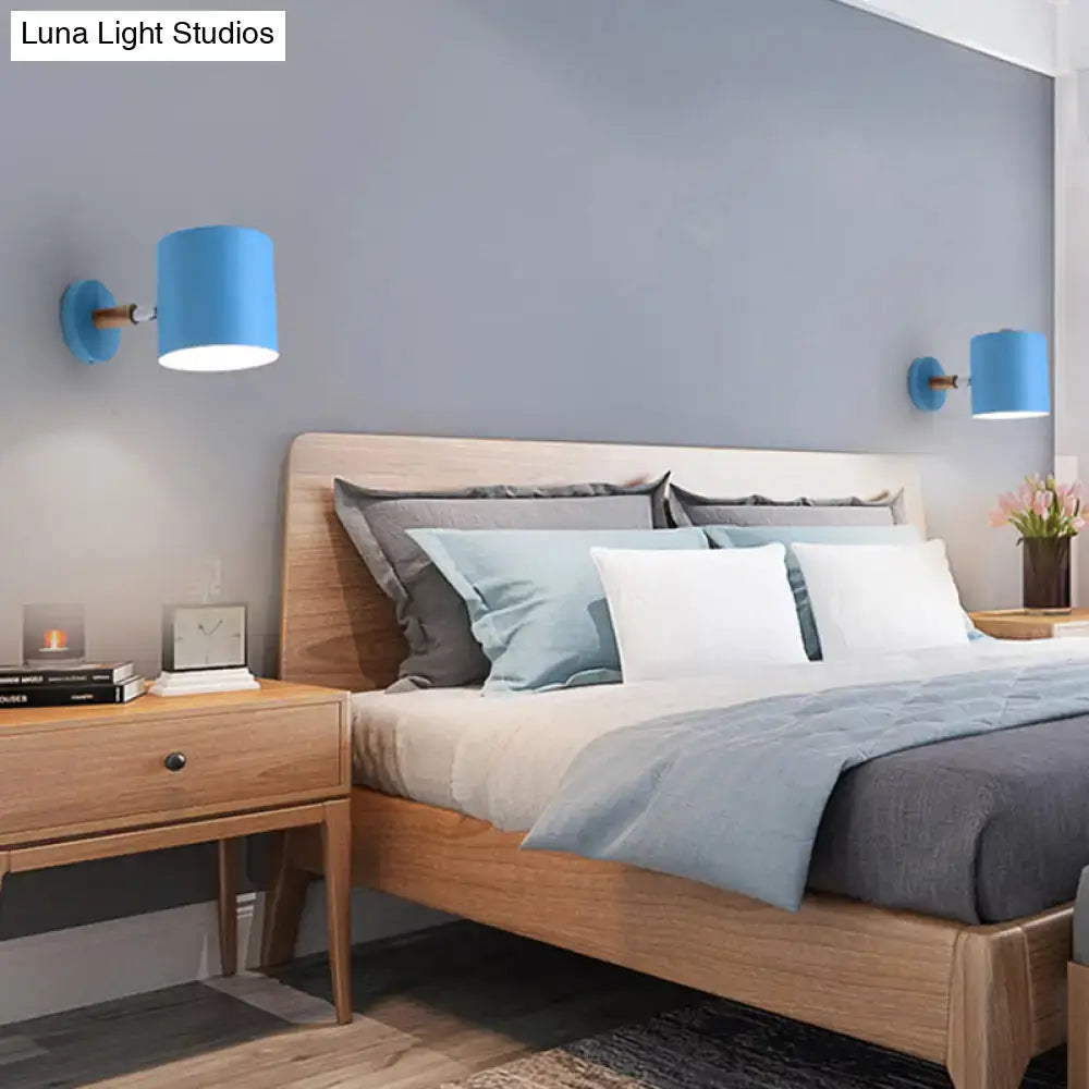 Modern blue metal tubular wall lamp with wood arm bedroom sconce light