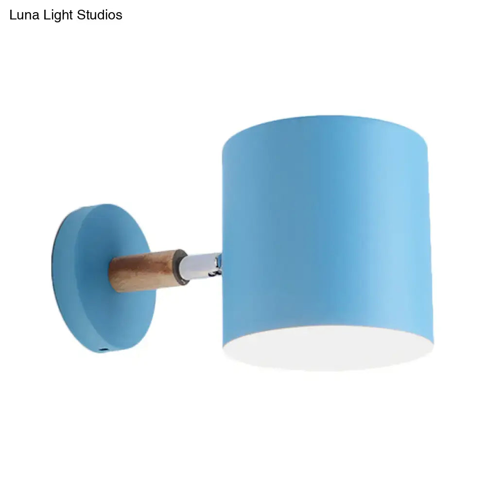 Modern blue metal tubular wall lamp with wood arm bedroom sconce light