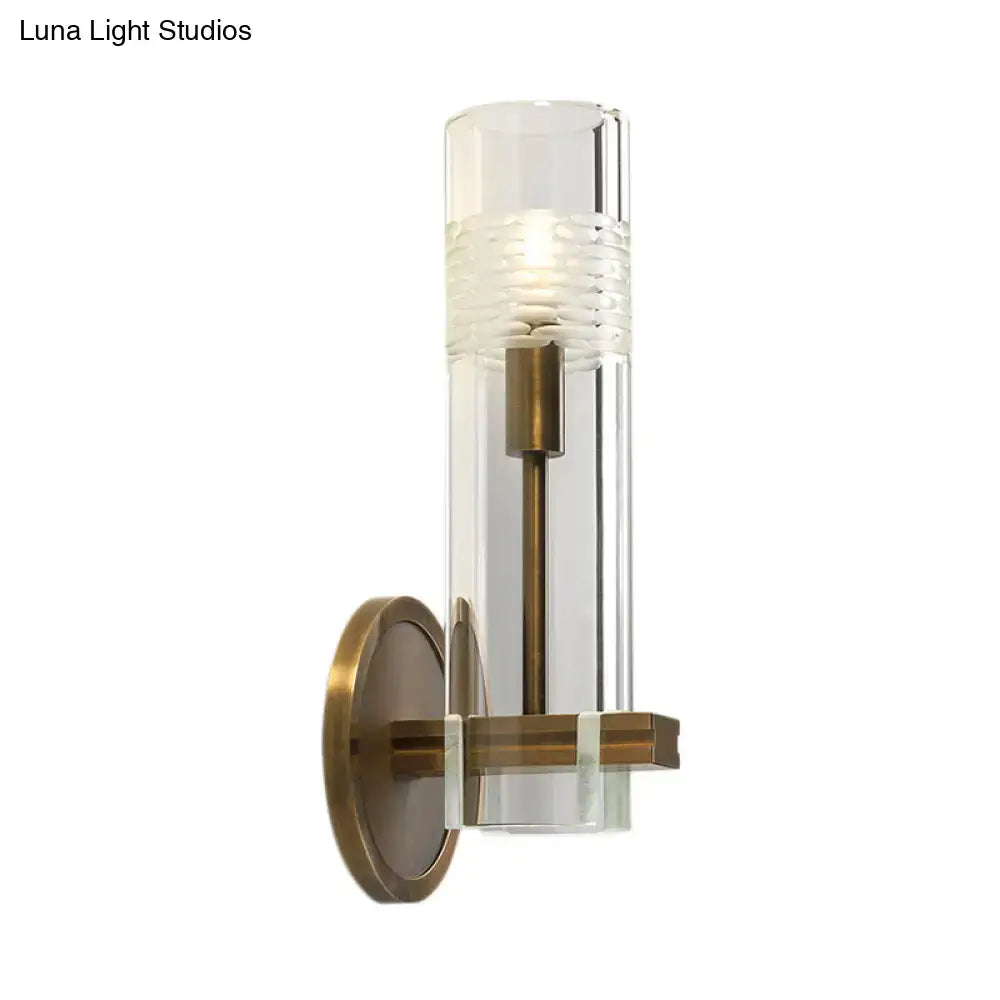 Modern brass and clear glass metal arm sconce bedroom wall light