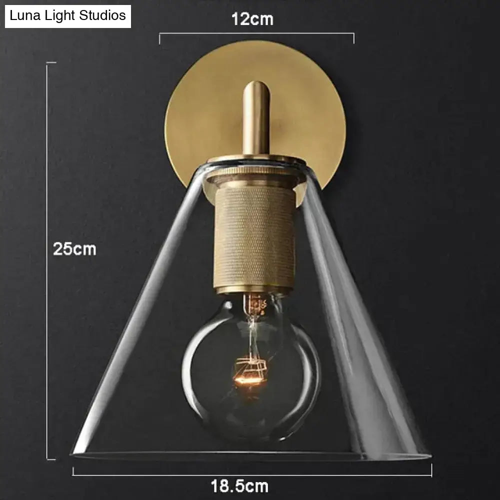 Modern brass and glass wall sconce bedroom light