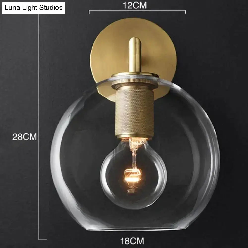 Modern brass and glass wall sconce bedroom light