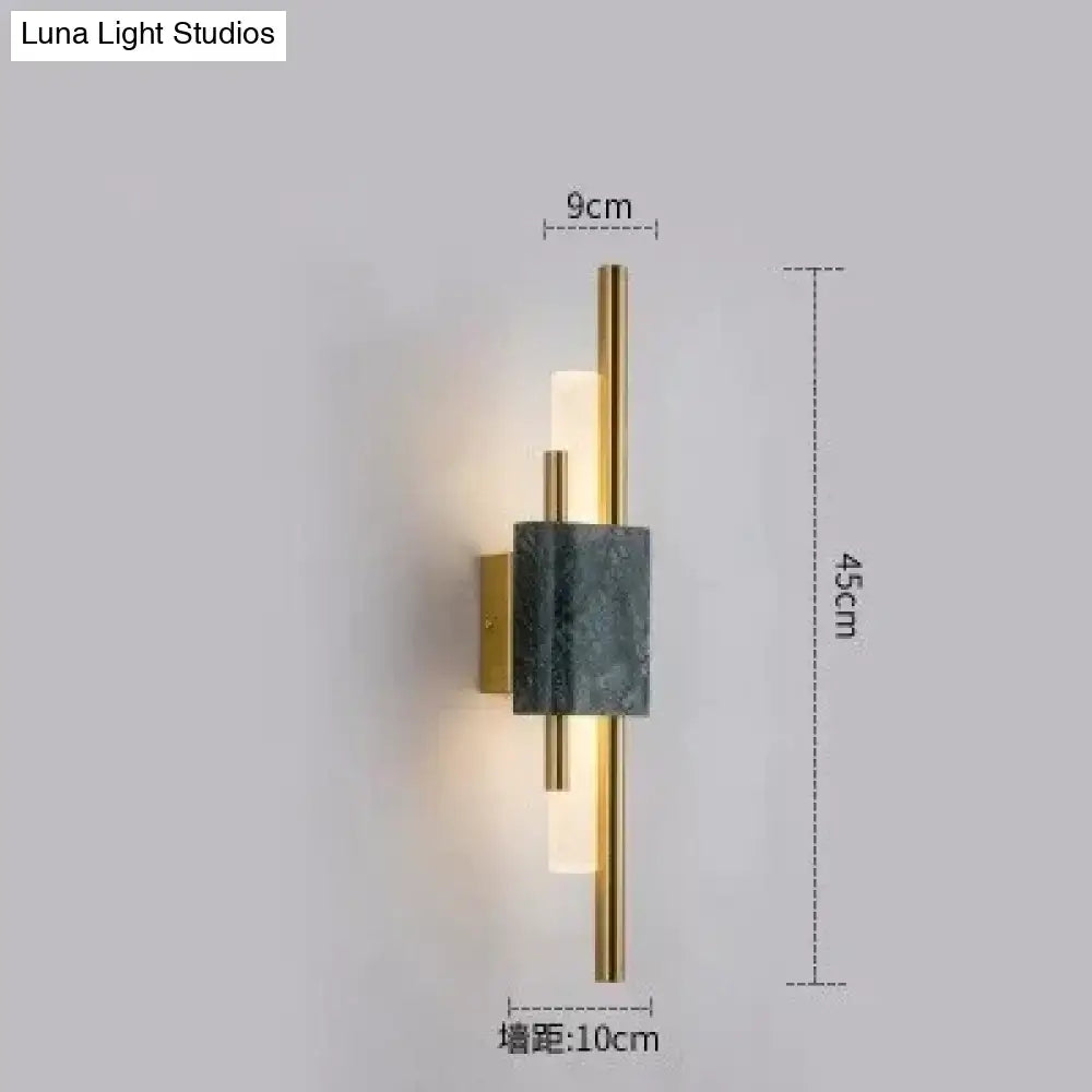 Modern brass and green marble led wall lamp with brushed gold frame dark gray marble accent and frosted glass diffuser