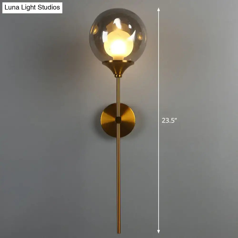 Modern brass and smoke gray glass wall light bedroom sconce