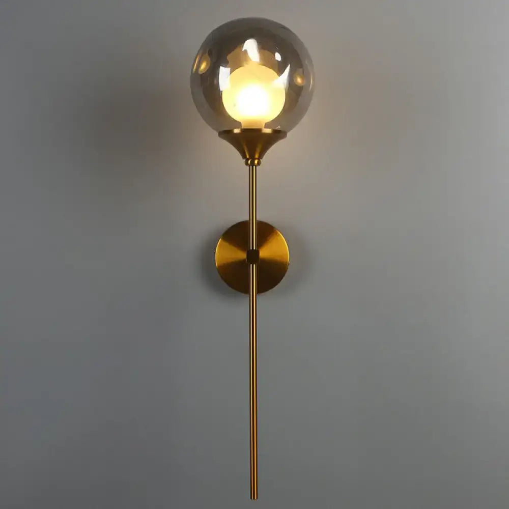 Modern brass and smoke gray glass wall light bedroom sconce