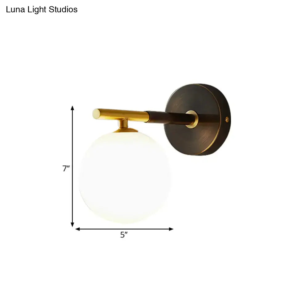 Modern brass and white glass wall sconce – bedroom globe light