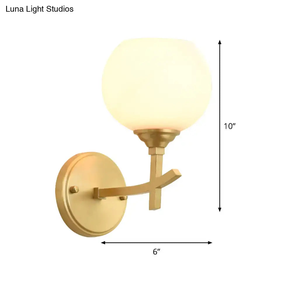 Modern brass armed sconce with opal glass shade bedroom wall lamp