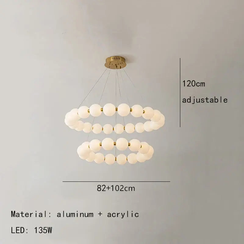 Modern brass led pendant light with frosted spheres for living room