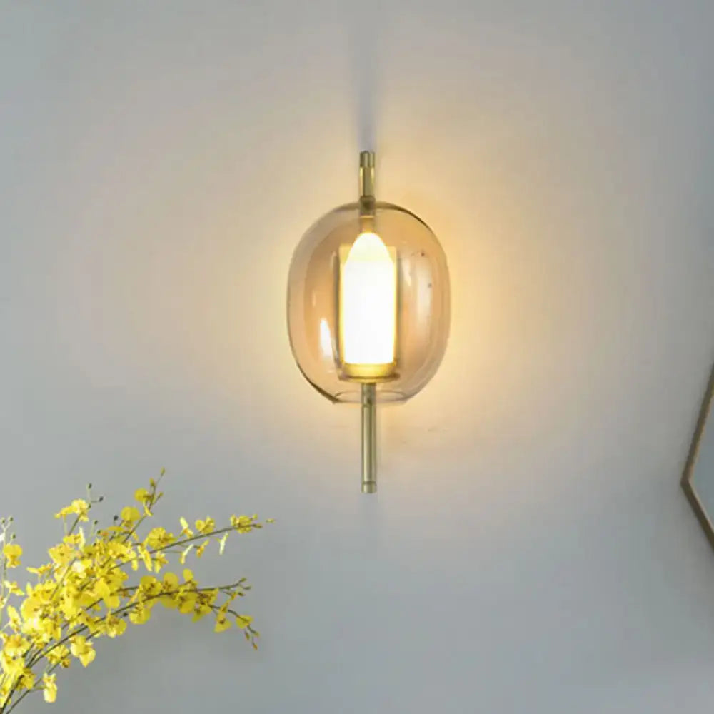 Modern brass oval clear glass shade wall sconce bedroom light