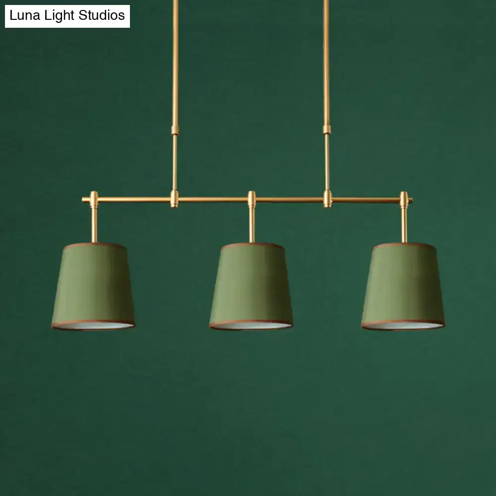 Modern brass pendant light with white green flaxen shades dining room