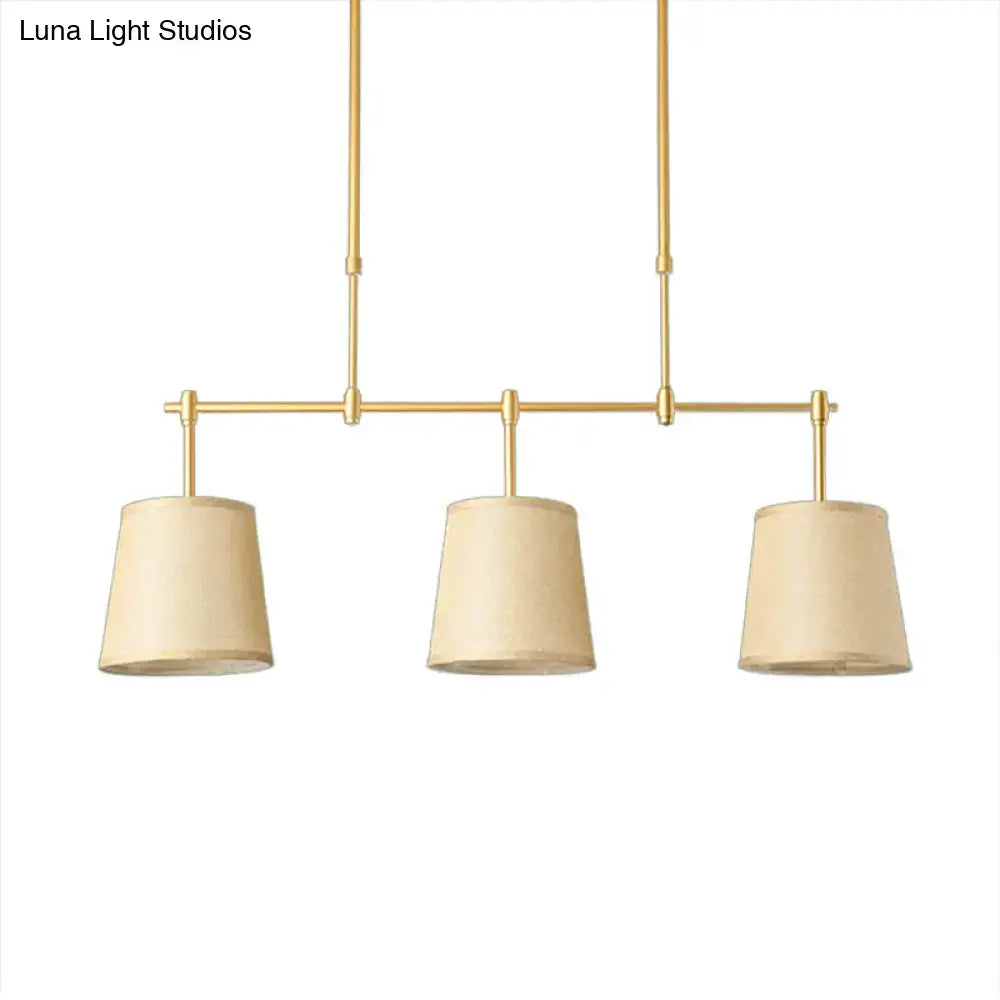 Modern brass pendant light with white green flaxen shades dining room