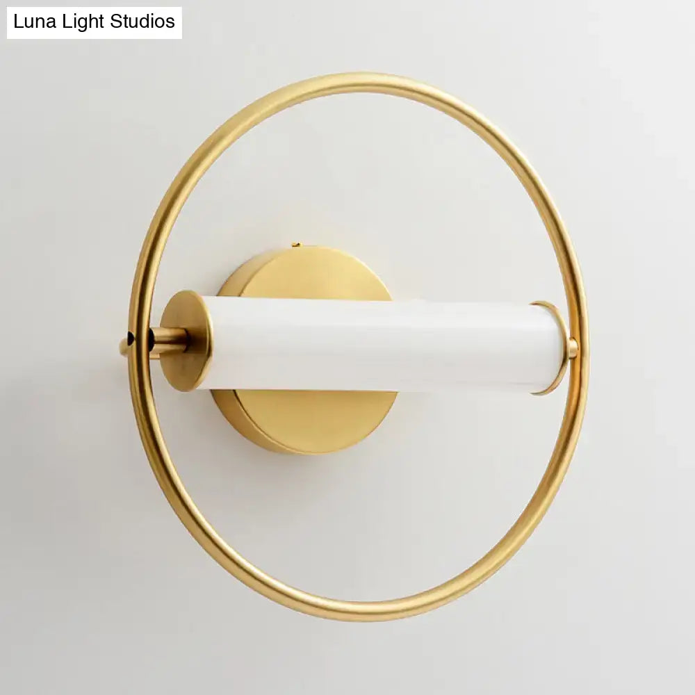Modern brass ring wall sconce with opal glass shade bedroom light