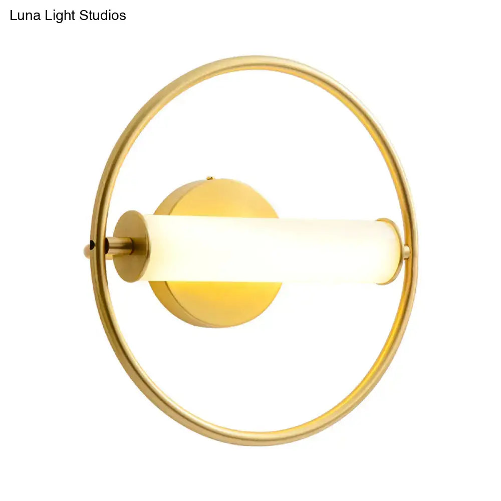 Modern brass ring wall sconce with opal glass shade bedroom light