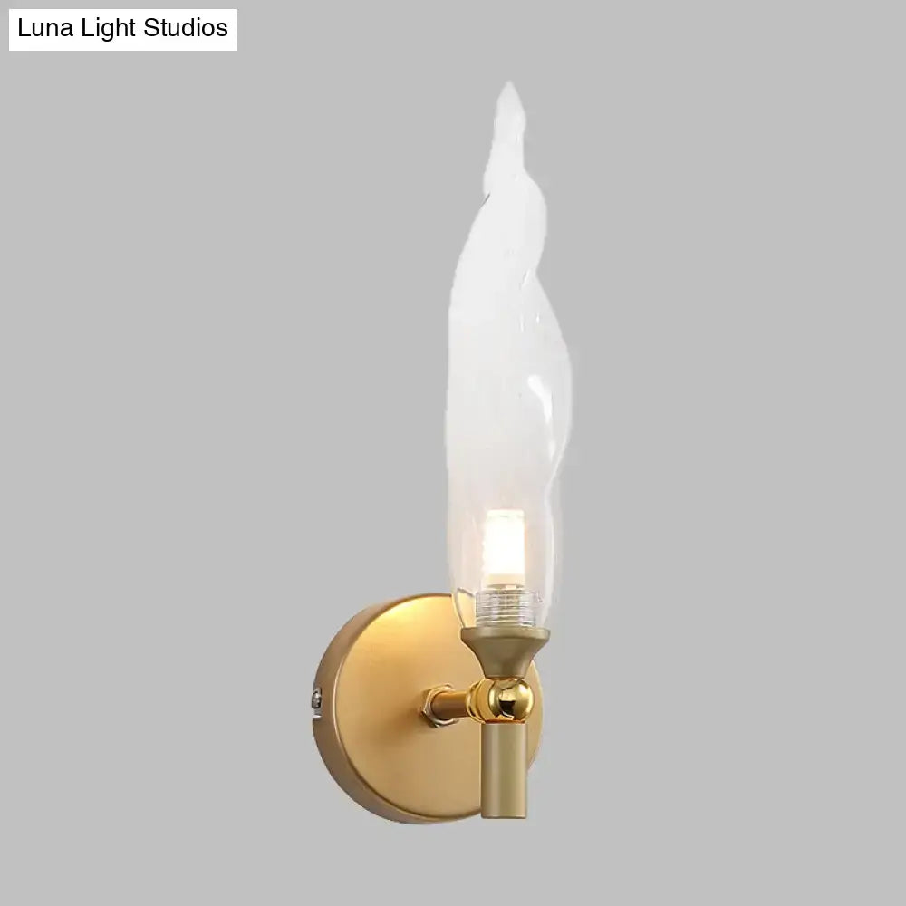 Modern brass torch sconce with clear glass bedroom wall lamp
