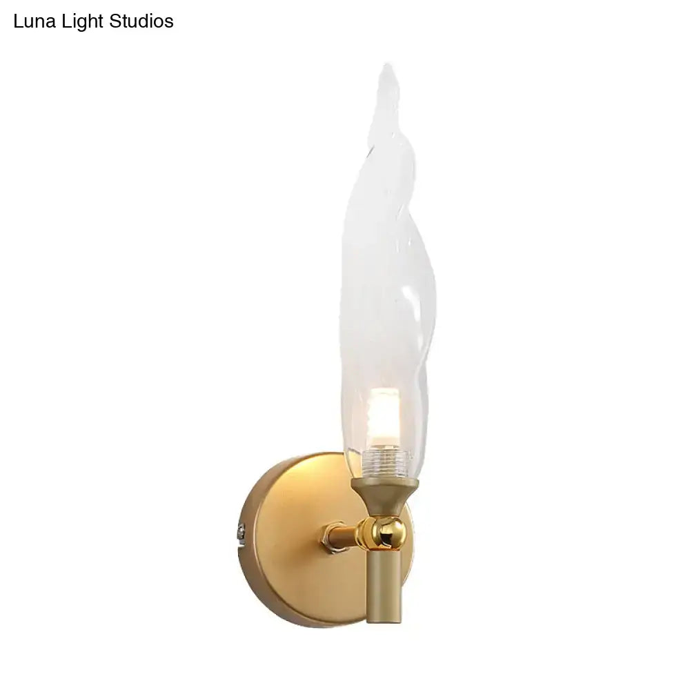 Modern brass torch sconce with clear glass bedroom wall lamp