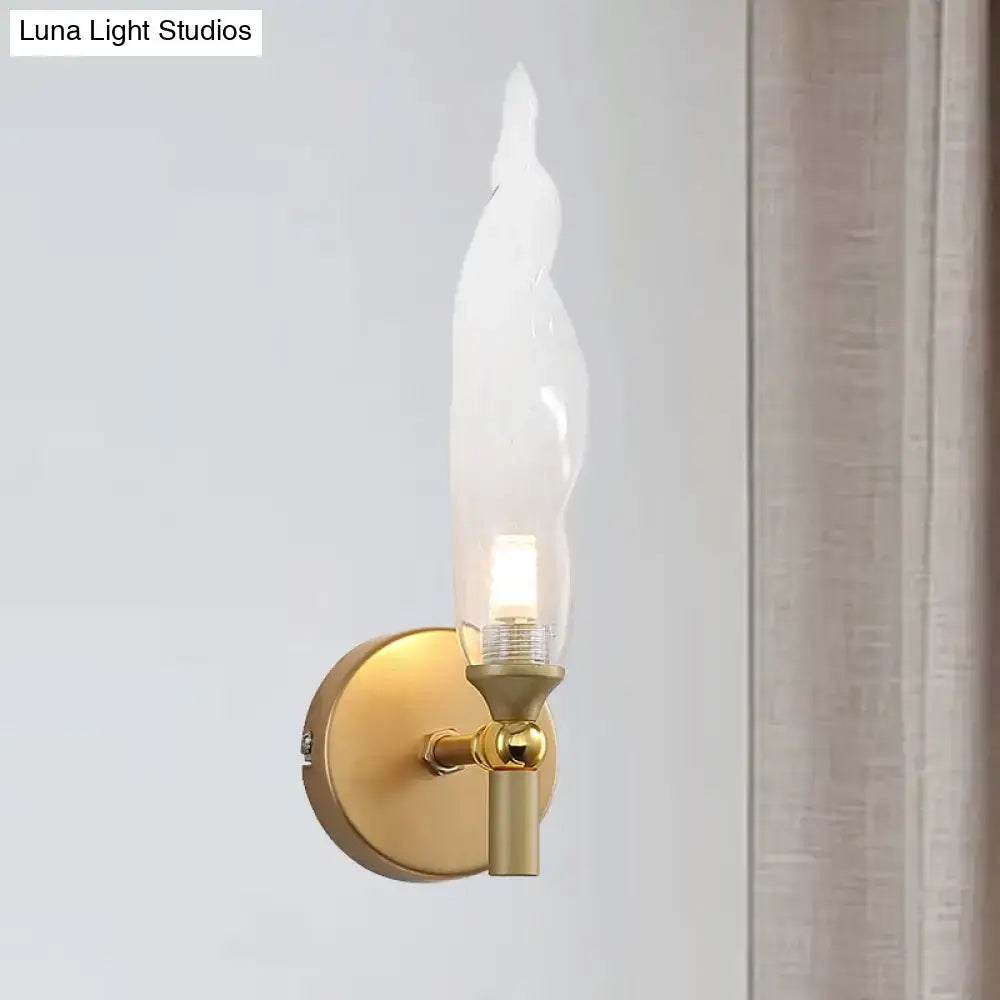 Modern brass torch sconce with clear glass bedroom wall lamp