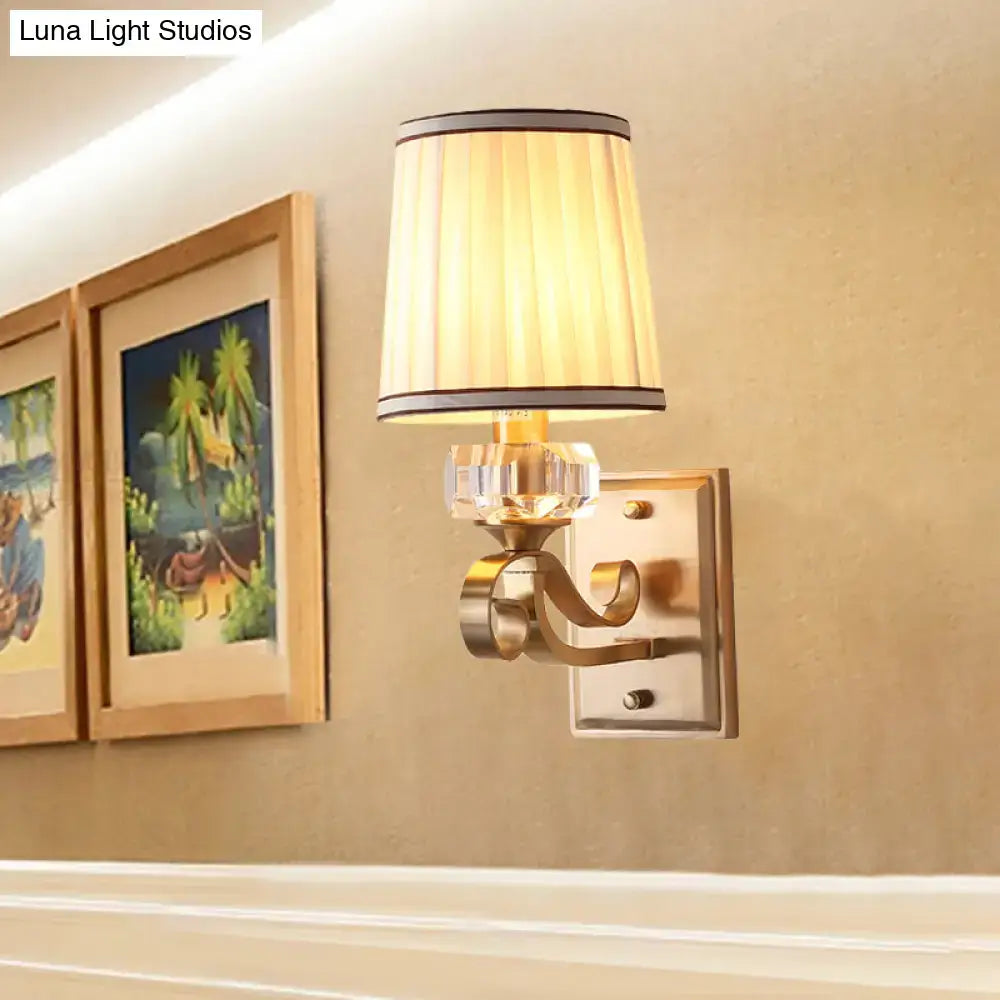 Modern brass wall lamp – bedroom sconce with pleated shade