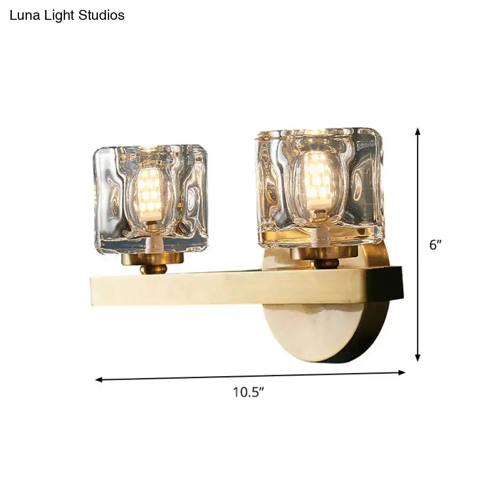 Modern brass wall light with clear crystal block for living room