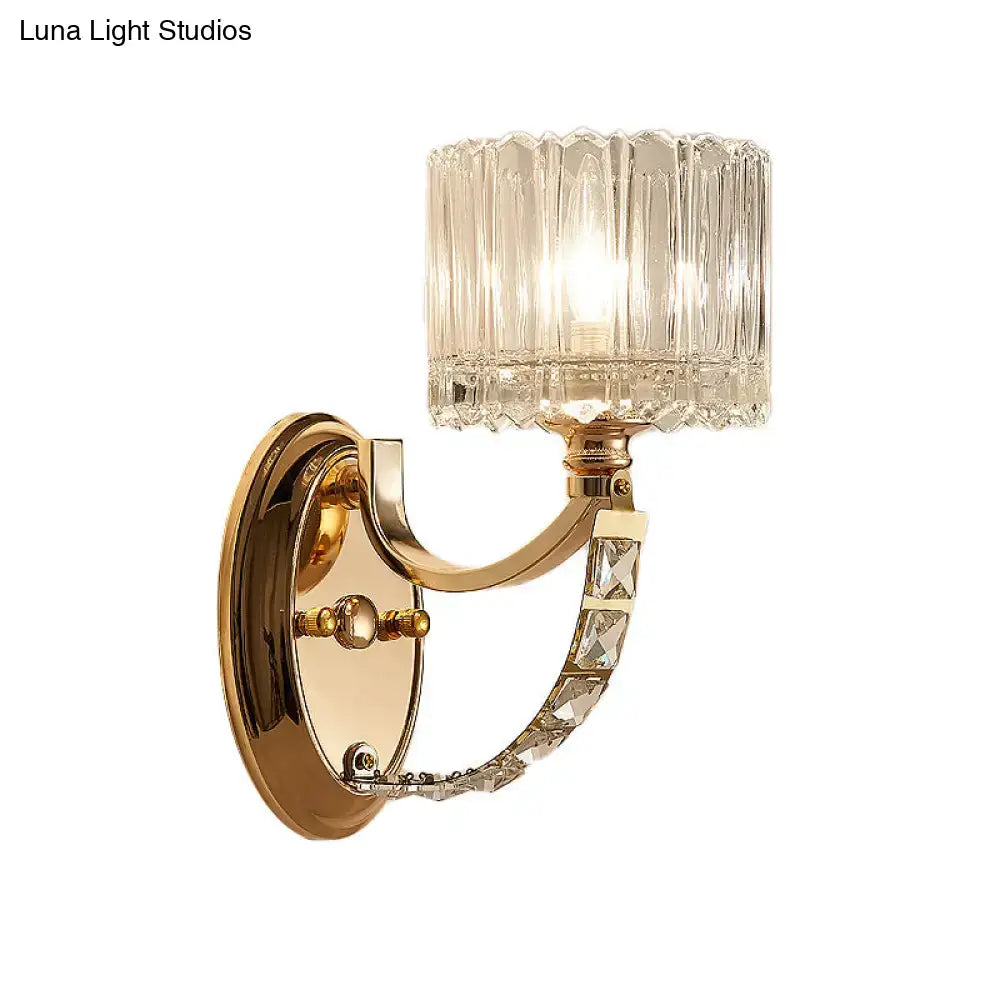 Modern brass wall sconce bedroom light with faceted clear glass shade