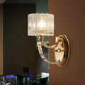 Modern brass wall sconce bedroom light with faceted clear glass shade