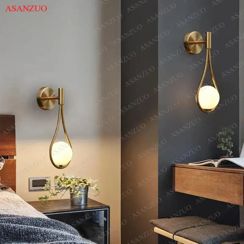 Modern brass wall sconce frosted glass teardrop living room light