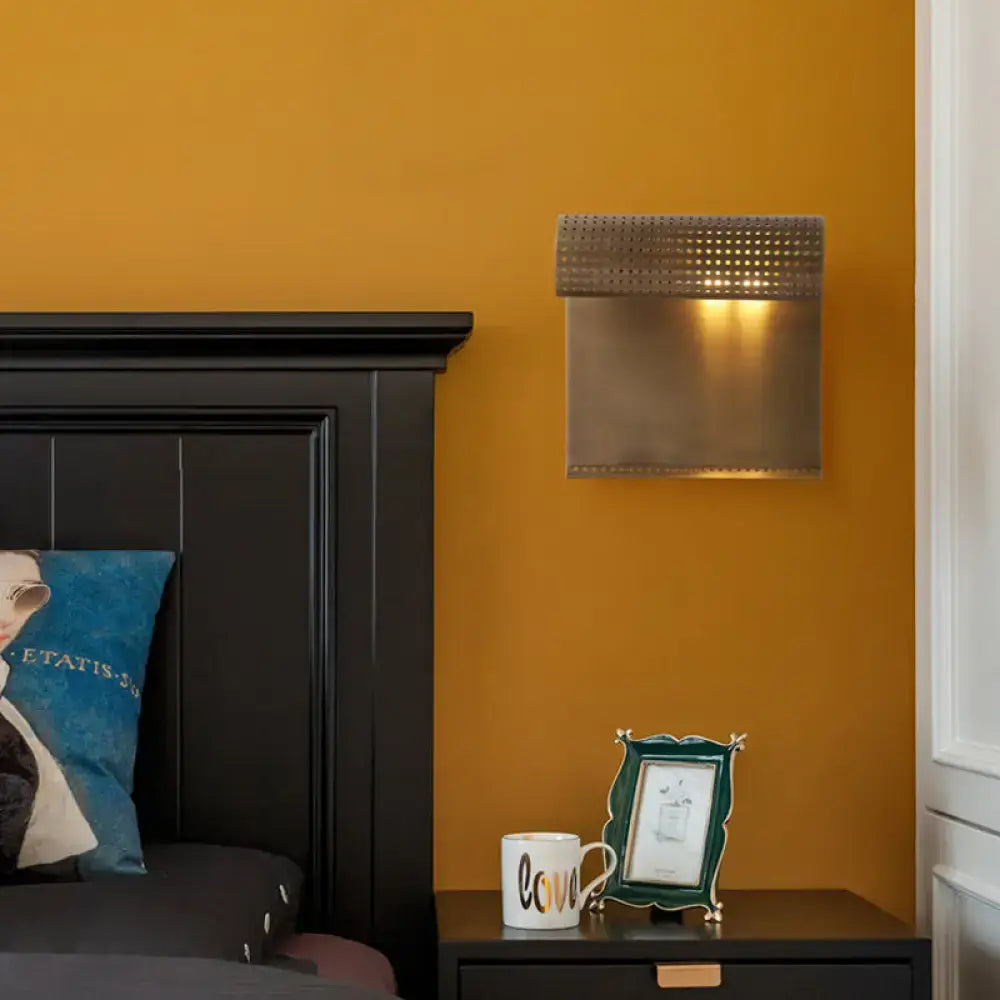 Modern brushed brass scrolled wall sconce for bedroom lighting