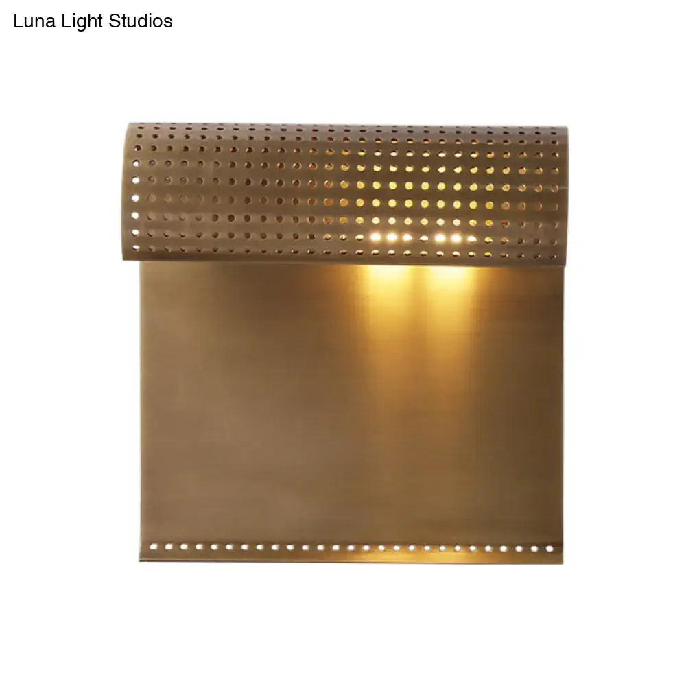 Modern brushed brass scrolled wall sconce for bedroom lighting